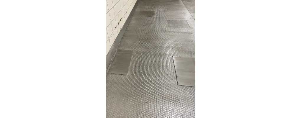 Chequer plate floor in an industrial building