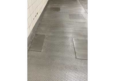 Chequer plate floor in an industrial building